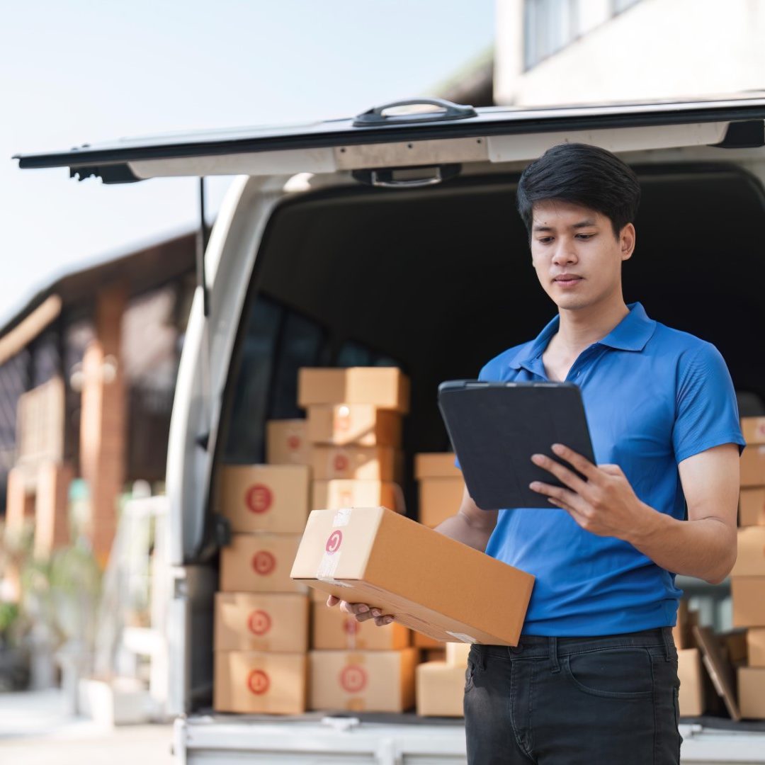 asian-courier-with-parcel-delivery-logistic-concept-delivery-man-checking-address-order-from-cardboard (1)