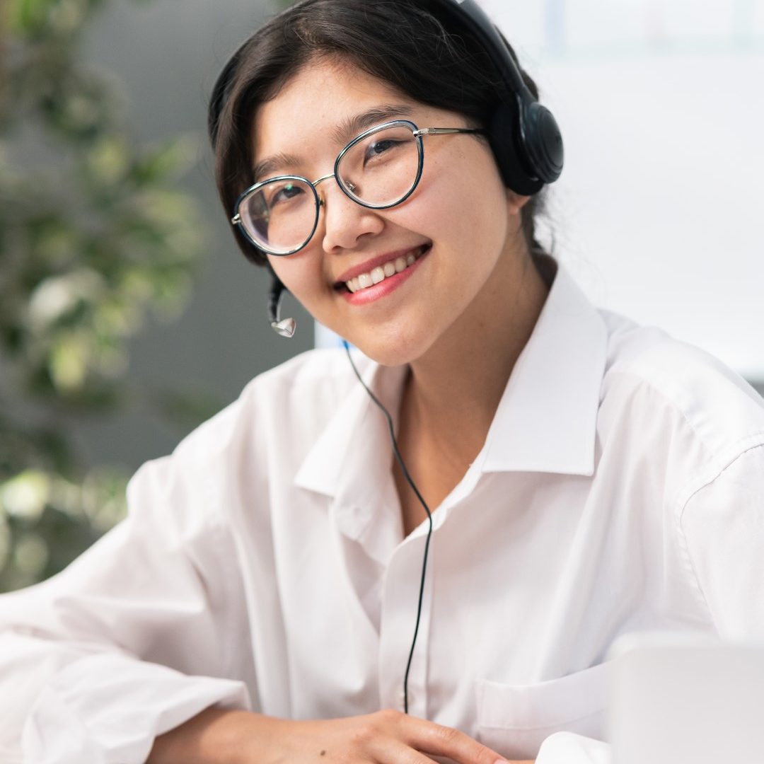 portrait-elegant-women-glasses-with-asian-korean-beauty-sits-office-company-with-headphones (1)